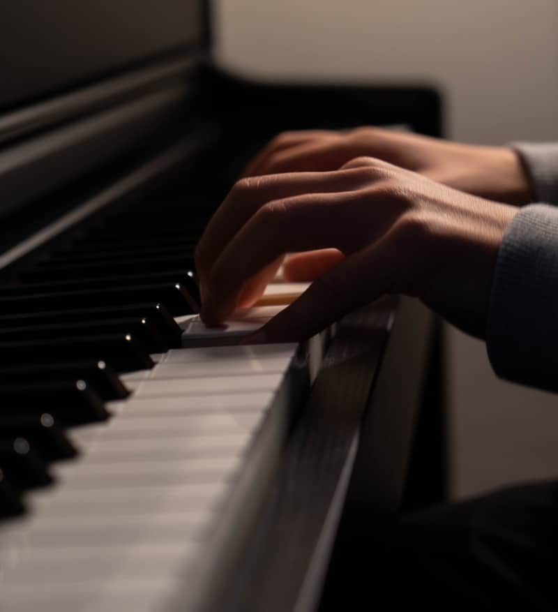 Hands playing piano