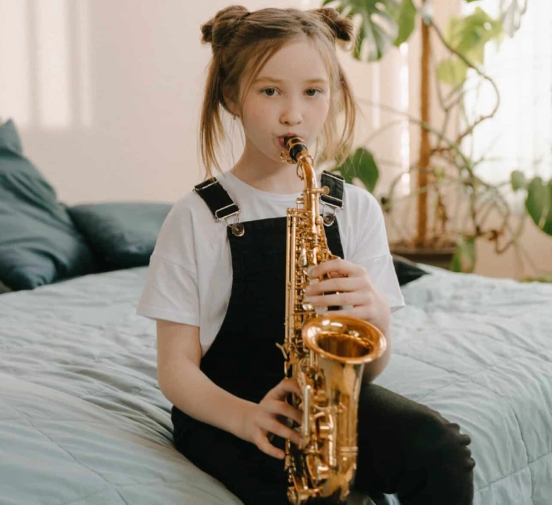 Child playing a saxophone